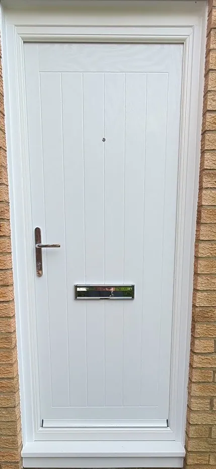 White composite front door with chrome handle and letterplate fitted by McKee Joinery in Ayrshire