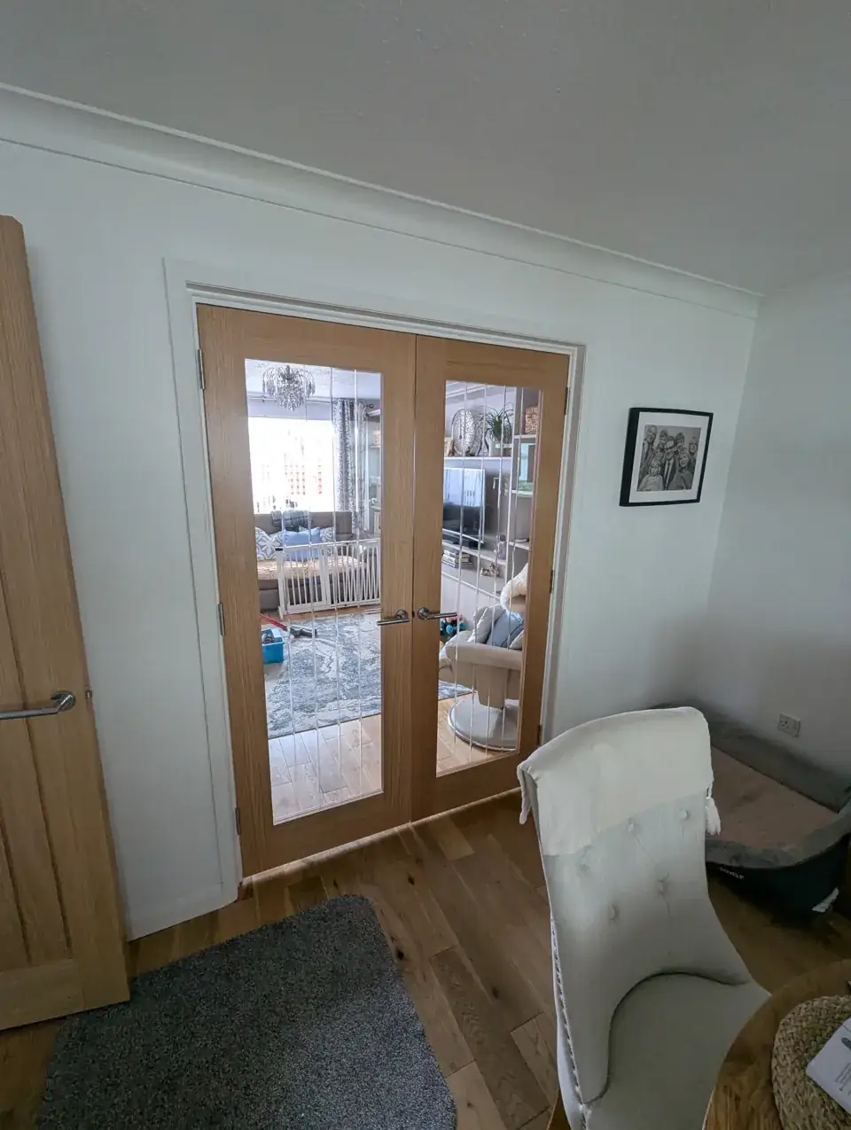 Pair of prefinished oak veneer glazed French doors fitted by McKee Joinery in Prestwick, Ayrshire
